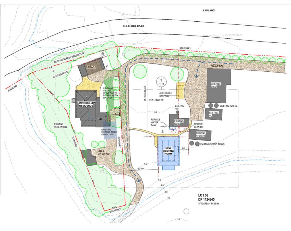 The meeting room sits within a cluster of farm buildings
