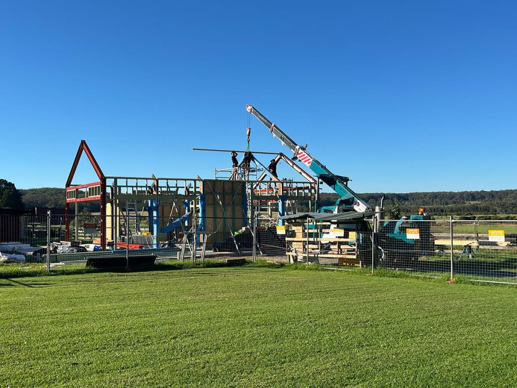Steel portal frames with a crane